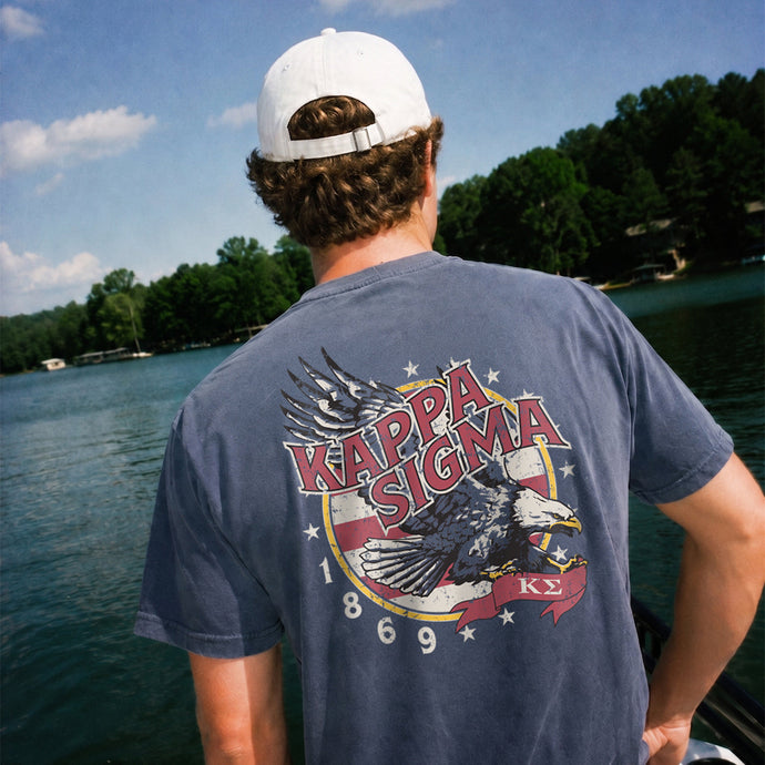 Man wearing a blue comfort colors tee with premium america design