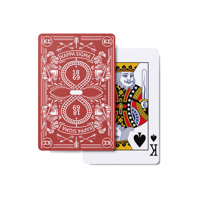 Fraternity brother holding custom Heritage Playing Cards during a poker game in a chapter house lounge.