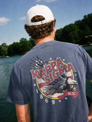 Man wearing a blue comfort colors tee with premium america design